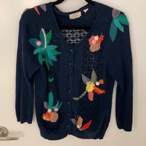 Crocheted cardigan with textured pops of color